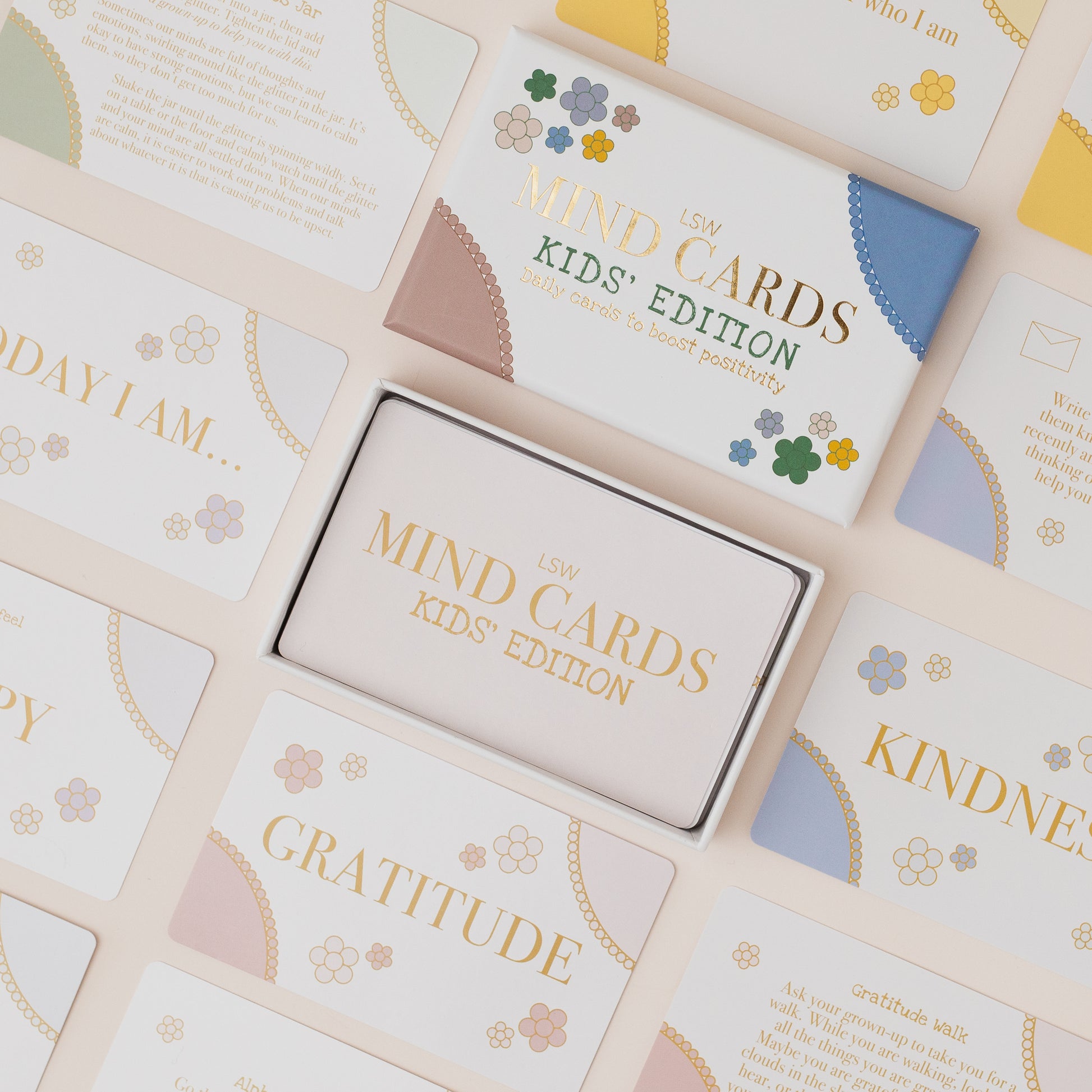 Set of 'Mind Cards Kids' Edition' with various cards and a box on a light background.
