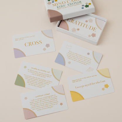 Mind Care Kids Edition card set with cards spread out on a beige surface